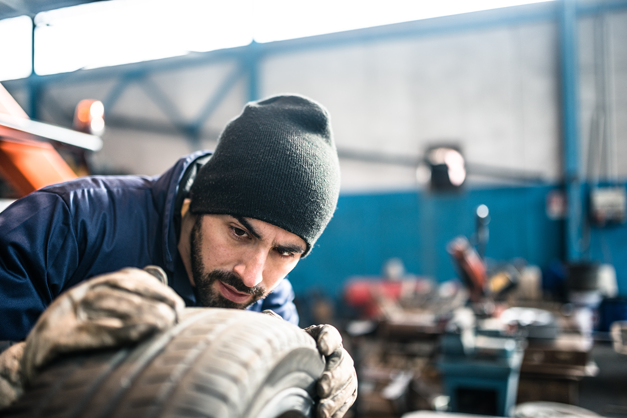 Watch for tire damage Tire repairer checking the tire integrity