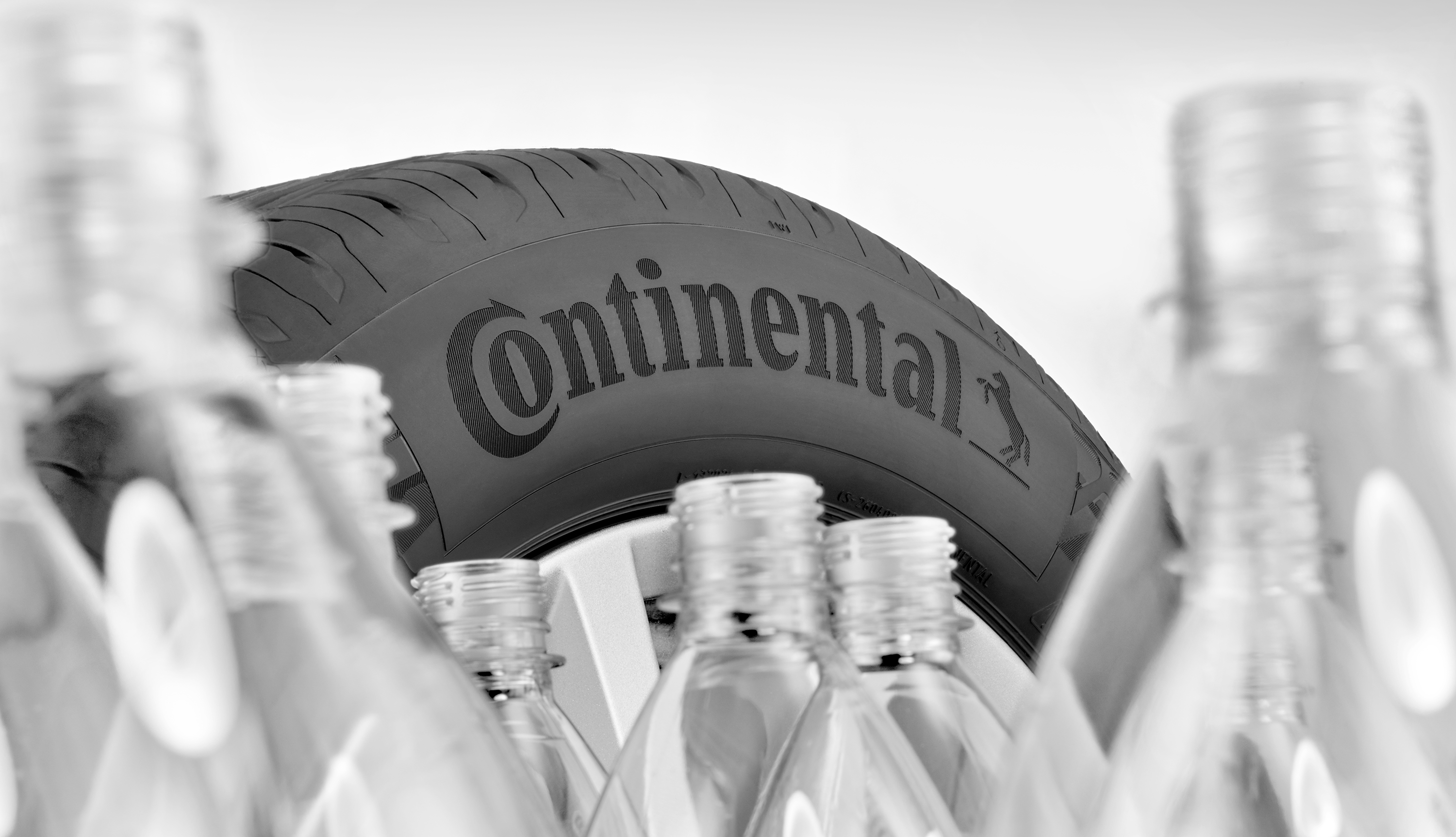 A EcoContact tire surrounded by pet bottles