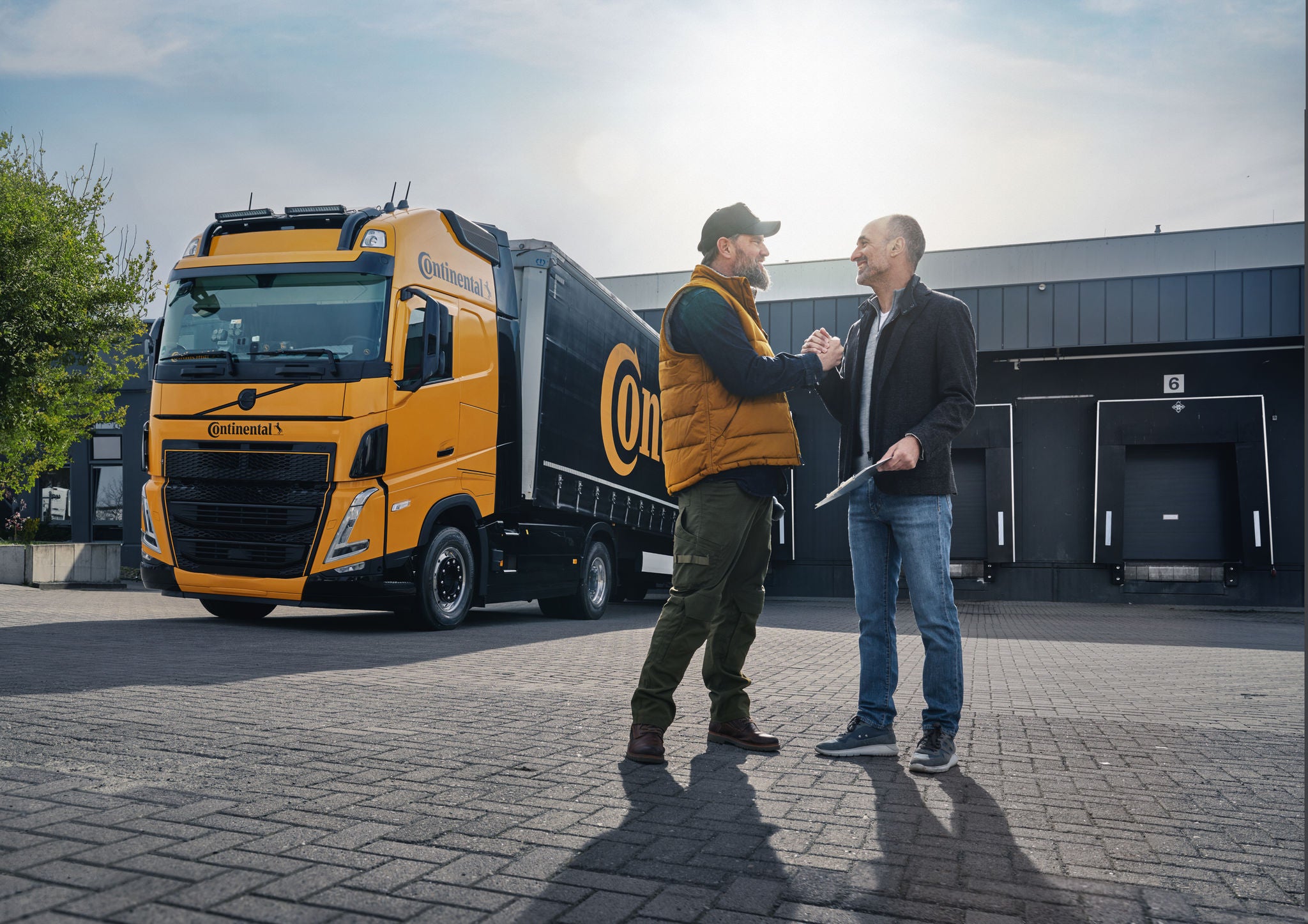 Truck Driver and Logistician outside of a warehouse