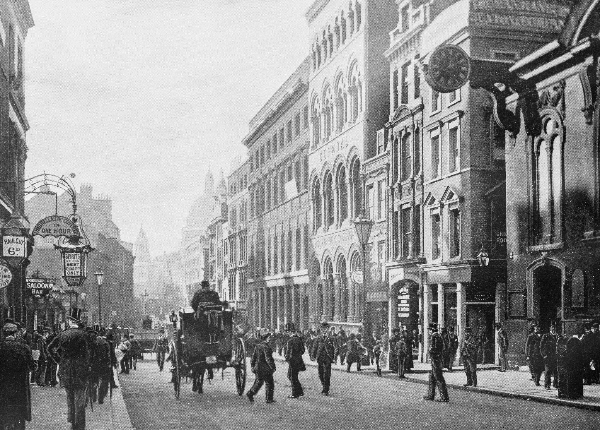 Pedestrians, cars and carts share the street in London