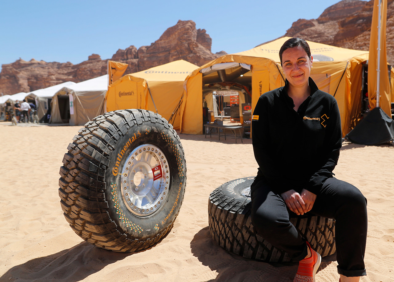 Catarina Silva sitting with Continental Extreme E race tires at the first race location: AlUla, Saudi Arabia ALULA, SAUDI ARABIA - Extreme E wheel